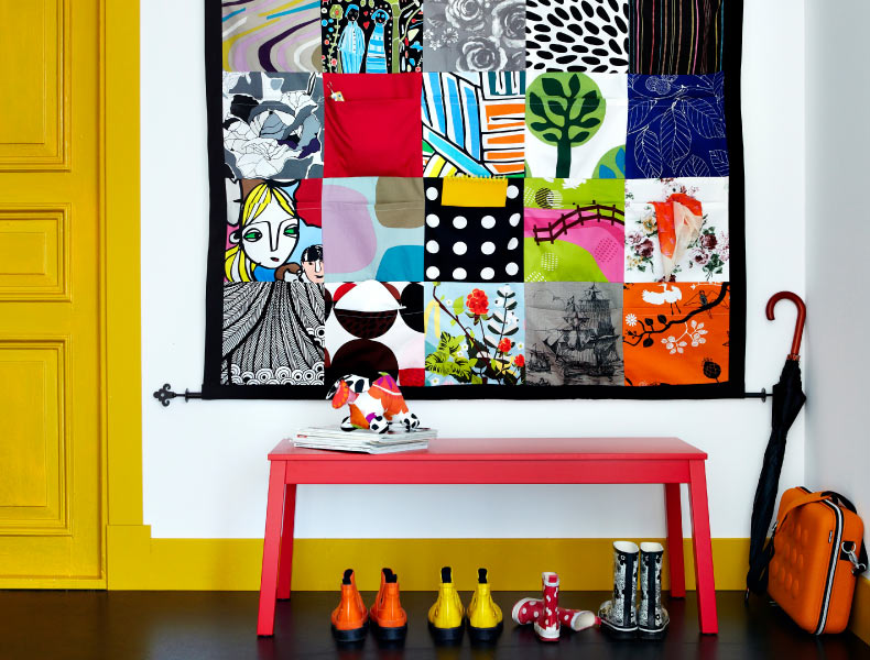 The patchwork organiser is the focal point of this bright and fun hallway 